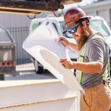 Construction worker reading plans